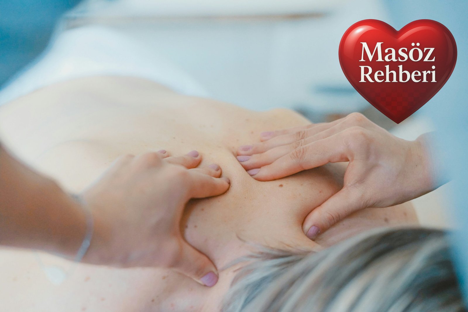 person massaging the back of a woman